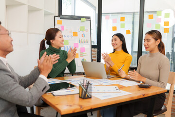Group of Asian businessmen are sitting in a meeting, talking, exchanging knowledge. Presentation about office work