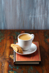 Cup of coffee and Cantuccini (Italian cookie) on dark wooden background. Copy space.