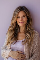 A serene woman with long hair poses gracefully against a soft purple background, exuding confidence and warmth.