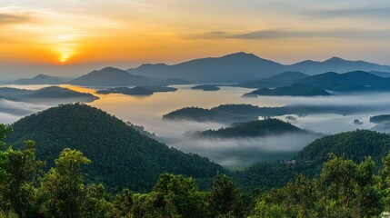 Obraz premium Serene Sunrise Over Misty Mountain Landscape