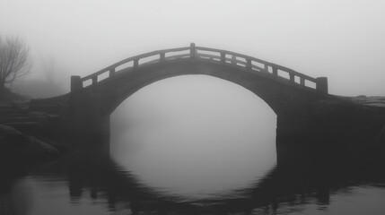 Fototapeta premium Misty Bridge Over Calm Water under Foggy Conditions
