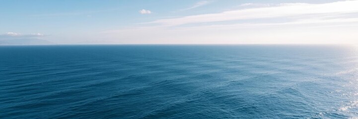Fototapeta premium Beautiful aerial view of a vast ocean with crystal clear blue water and gentle waves, vacation, coast
