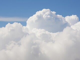 Fluffy white clouds floating in a blue sky on a sunny day, ethereal, daytime