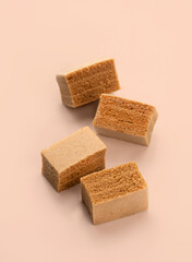 Cubes of apple marshmallow lie on a light background