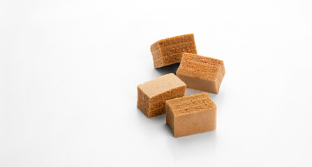 Cubes of apple marshmallow lie on a light background