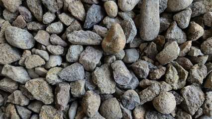 Pile of rubble top view. Top view of gravel or stone. Backdrop of the gray gravel cobblestones. Stone background. Extreme closeup