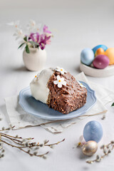 Spring Easter baking on a light table among flowers and painted eggs