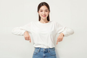 A woman is wearing a white shirt and blue jeans
