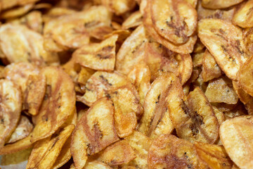 Kerala chips or Banana chips, Honey Baked Banana Slices on white background.