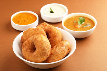 Traditional breakfast of South India IDLY VADA served with sambar Chutney in a ceramic plate