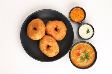 Traditional breakfast of South India IDLY VADA served with sambar Chutney in a ceramic plate