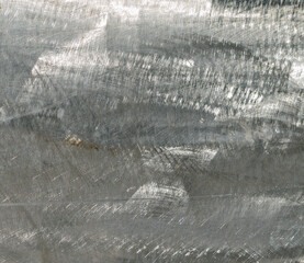Close-up of brushed steel with a rough pattern ideal for use as a background