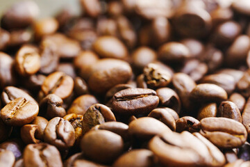 beans of roasted natural coffee. coffee background and texture. Aromatic invigorating drink.