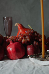 Autumn still life harvest Thanksgiving table serving with pumpkins pommegranates and grapes