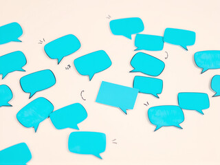 blue chat bubbles on beige background
