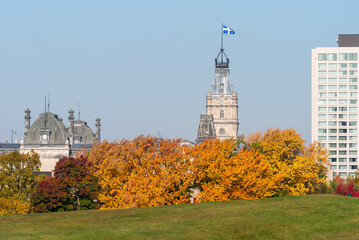 The tower of the Quebec parliament with in foreground the battlefields park of the plains of...