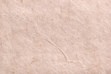 Textured beige wrinkled handmade paper background. Horizontal background for design