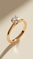 A minimalist product shot of an engagement ring with a rose gold band and round diamond, centered on a soft pastel background.