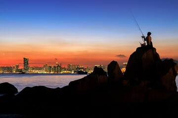 Dramatic Sunset Over Rocky Coastal Shoreline, Lei Yue Mun, Hong Kong