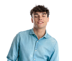 attractive young guy in blue shirt smiling with eyes closed