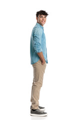 Fototapeta premium casual young man standing in line with hands in pockets