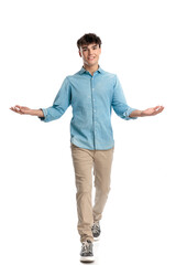 handsome young man in denim shirt opening arms and greeting