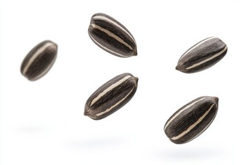 Obraz premium Multiple striped sunflower seeds suspended and isolated against a white background. Ideal for themes related to healthy snacks, nutrition, and natural foods.