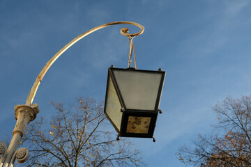 street lamp against blue sky