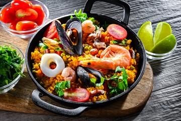 Seafood paella served in a cast iron pan
