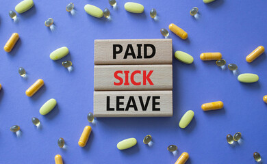 Paid Sick Leave symbol. Concept words Paid Sick Leave on wooden blocks. Beautiful purple background...