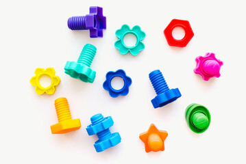 Plastic bolts on a white background. Bolts on a white background. Children's toys.