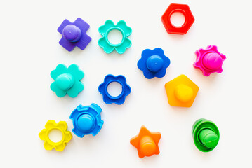 Plastic bolts on a white background. Bolts on a white background. Children's toys.