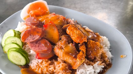 Red pork and crispy pork on rice, food in Thailand.