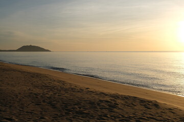 The sun rises at the sea in the morning.