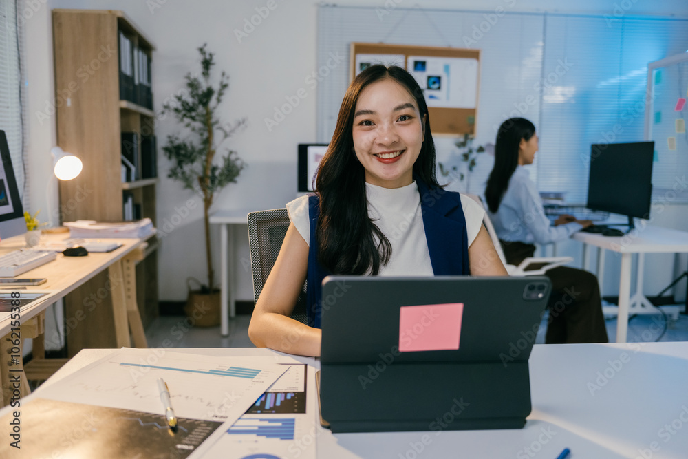 Poster young business woman using tablet and working with financial chart document at workplace in office, 