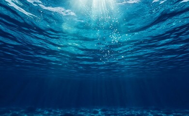 French Mediterranean sea with sun and bubbles rising to the surface and some fish in the background