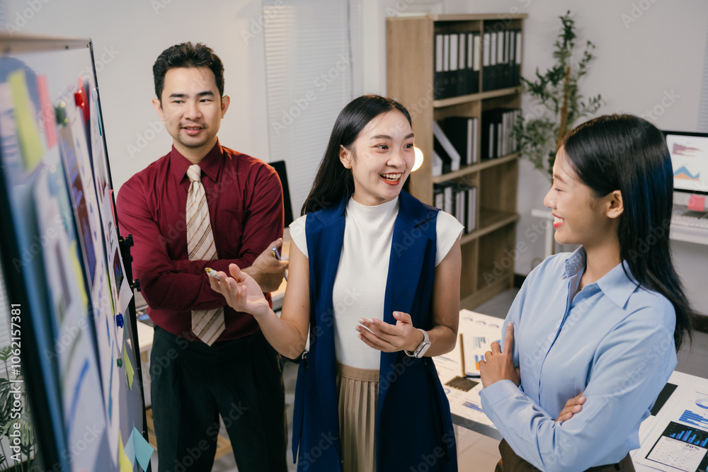 Poster three asian businesspeople are discussing a new strategy in a modern office, brainstorming and shari