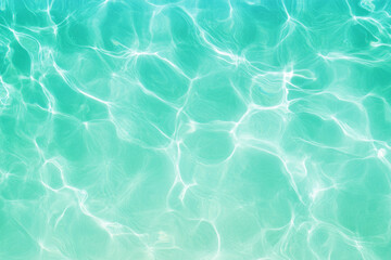 Bright turquoise water with gentle ripples under sunny daylight