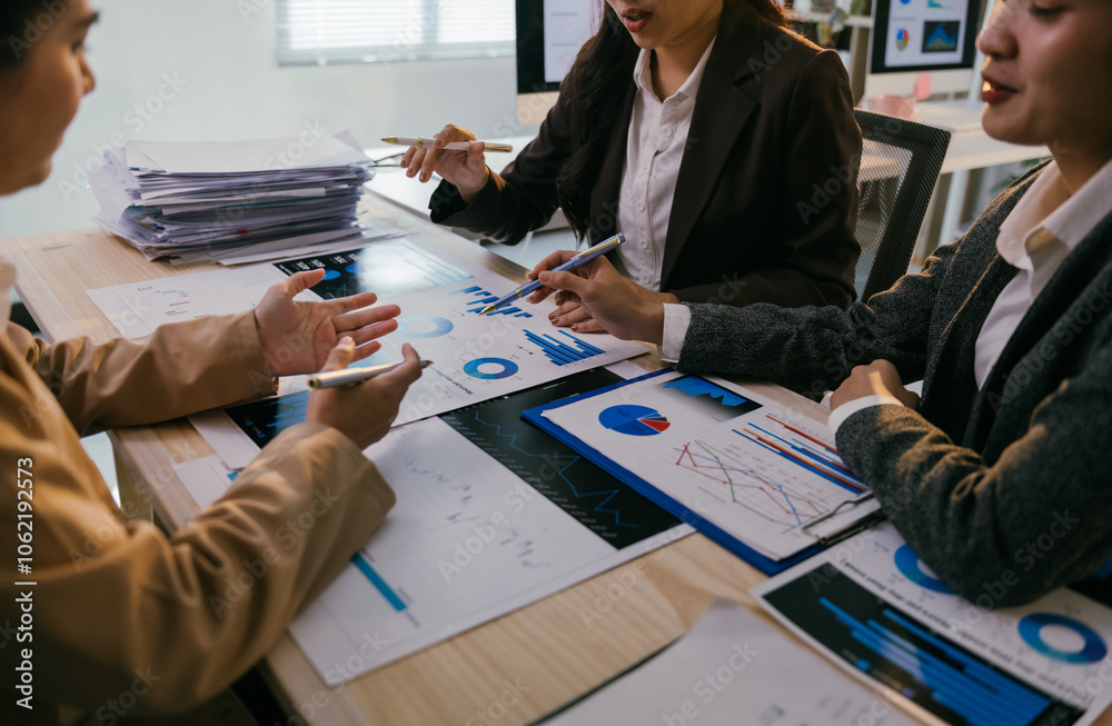 Poster business team analyzing financial charts and graphs, discussing company performance and making strat