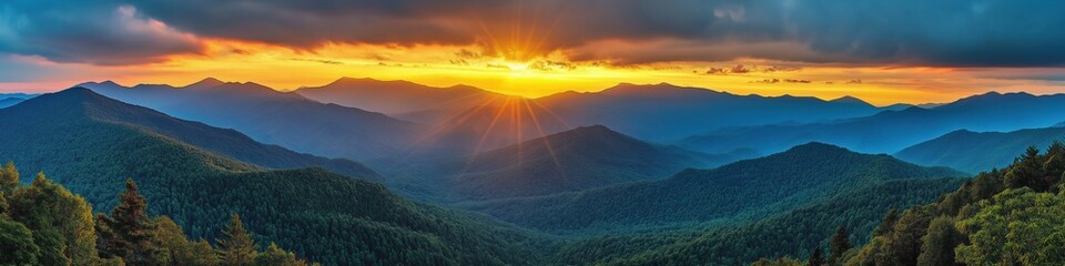 A beautiful mountain range with a bright orange sun in the sky. The sun is shining on the mountains and creating a warm, peaceful atmosphere