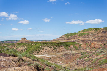 Majestic Badlands Landscape Under Bright Blue Sky