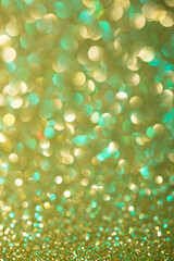 Shimmering emerald and gold bokeh backdrop