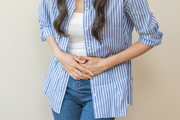 Flatulence asian young woman intolerance hand in stomach ache, suffer from food poisoning,...