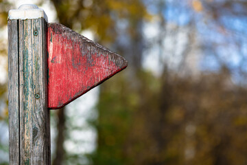 Red wooden flag on an abandoned playground