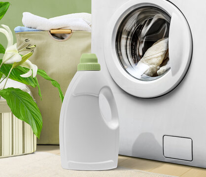 A bottle of modern natural detergent near the washing machine in