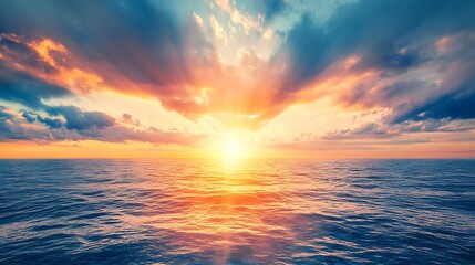 Fototapeta premium A vibrant, colorful sunset over the ocean with a clear area for text