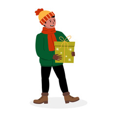 A cheerful person holding a green gift box while dressed warmly for winter festivities