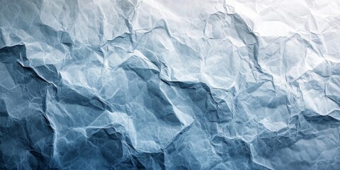Obraz premium An abstract background featuring a subtle texture of crumpled blue paper with varying shades and depth