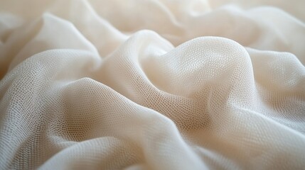 A soft, light abstract background featuring delicate, textured fabric with gentle folds and ample copy space