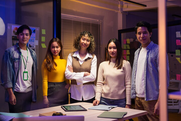 Portrait of creative business team. Creative Startup Young business people in late-night project meeting in a modern office.